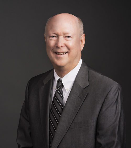 Brad Wilsion, attorney at Adams, Hemingway, Wilson & Rutledge, LLC, wearing a white dress shirt and gray tie under a gray suit jacket.